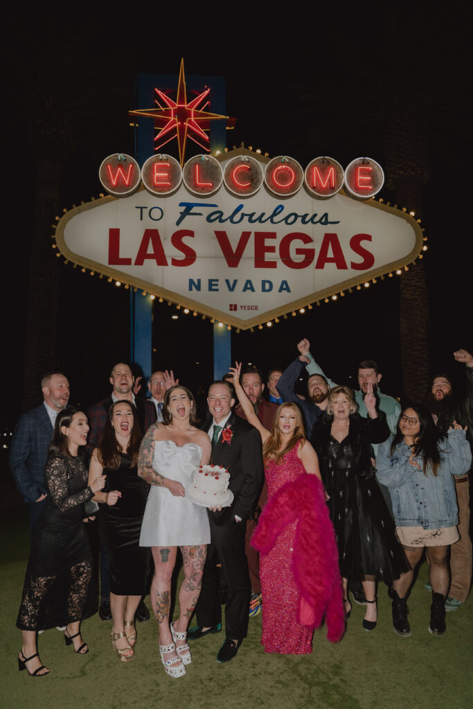 wedding party at las vegas sign