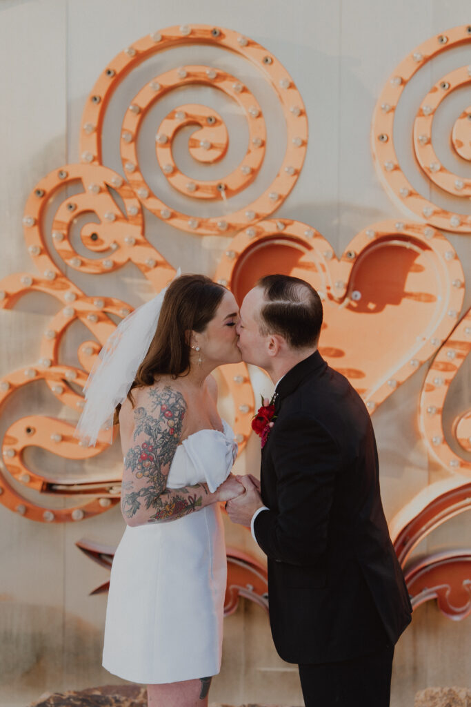first kiss wedding neon museum