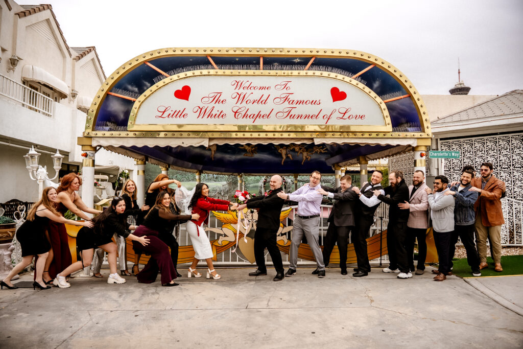bridal party outside little white chapel